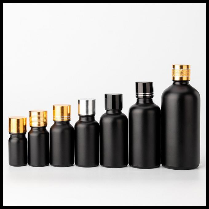 Forme ronde givrée par noir d'emballage cosmétique de bouteilles en verre d'huile essentielle de couleur
